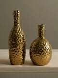 Golden hammered vases